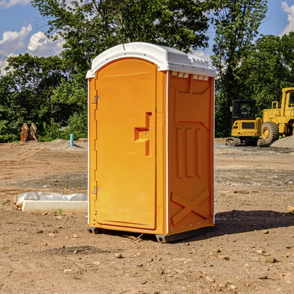 what is the cost difference between standard and deluxe porta potty rentals in Dunseith